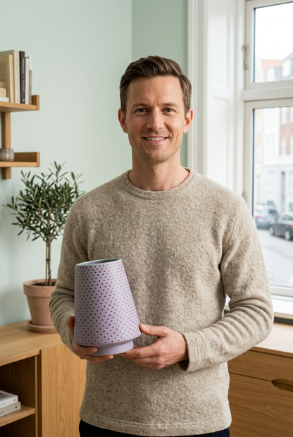 Male model holding Lilac Confetti vase